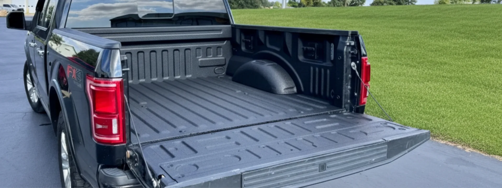Black Ford F-150 truck bed with durable Flak Jacket Pro liner